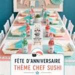 Une table décorée pour une fête d'anniversaire sur le thème du sushi, avec des plats colorés.